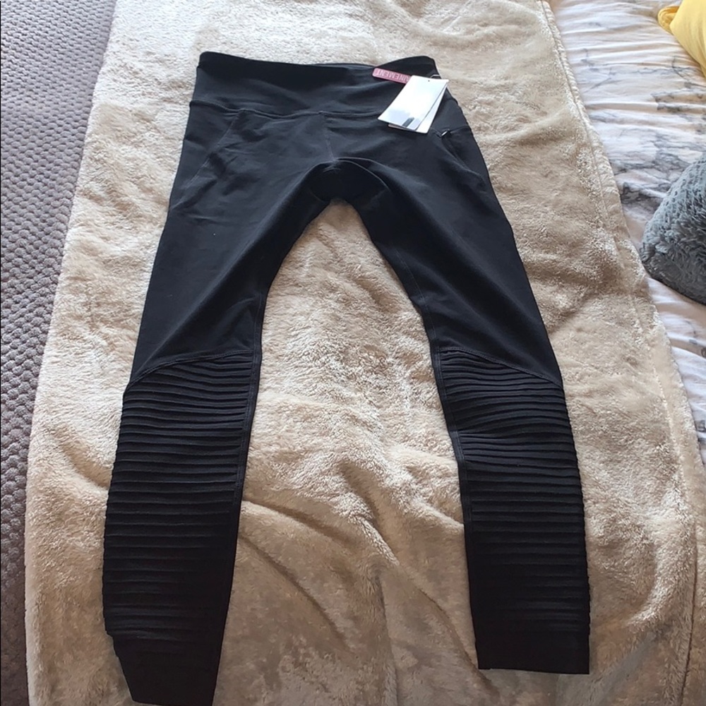 Black athletic leggings with ruffles